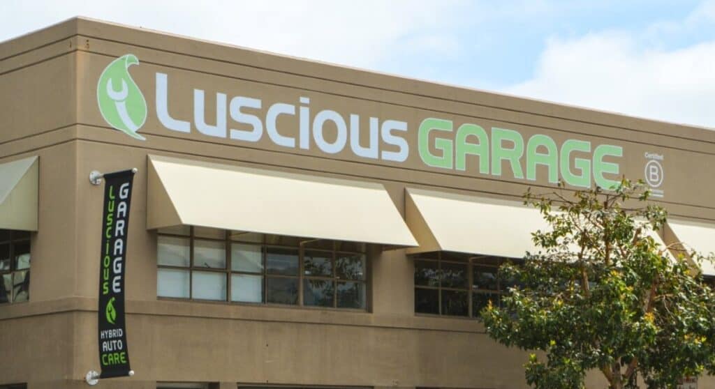 Image showcasing Luscious Garage building and sign