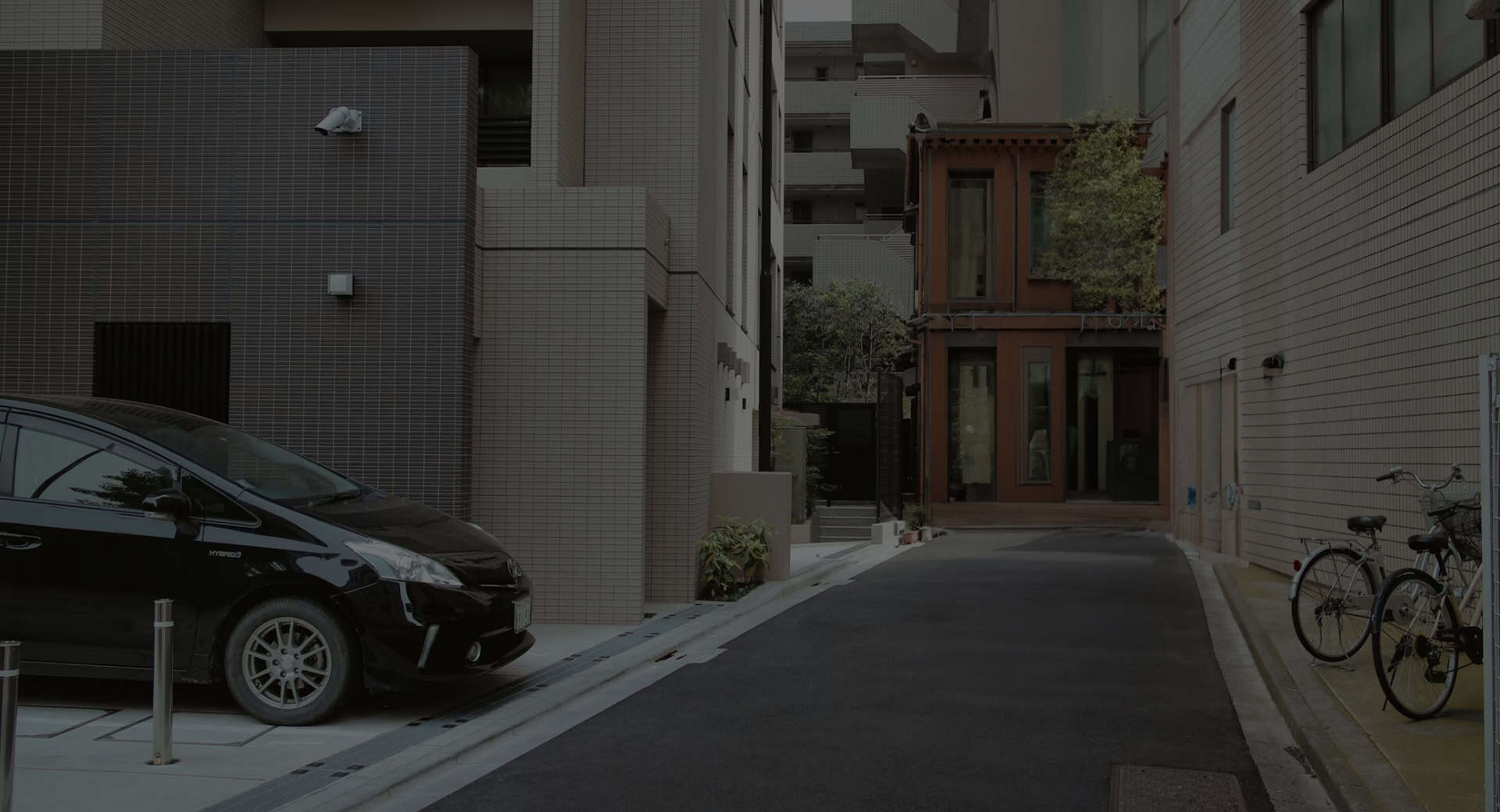 A Hybrid Toyota Vehicle Parked on the side of a residential street