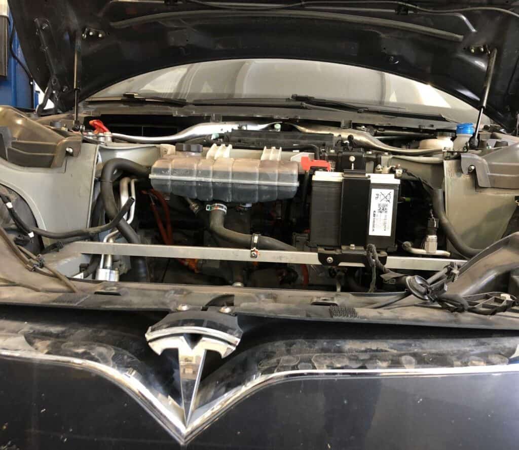 A Tesla low voltage battery installed