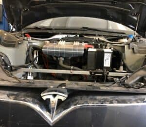 A Tesla low voltage battery installed