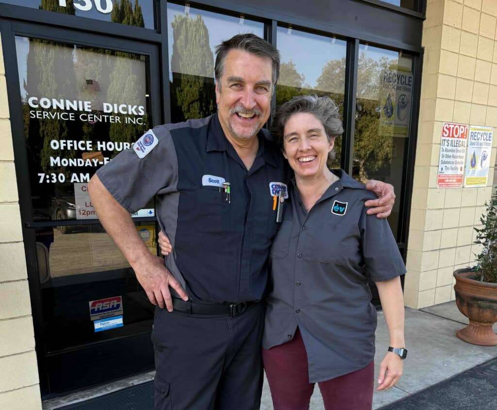 Scott Brown and Carolyn Coquillette in front of Connie and Dick's Service Center in Claremont